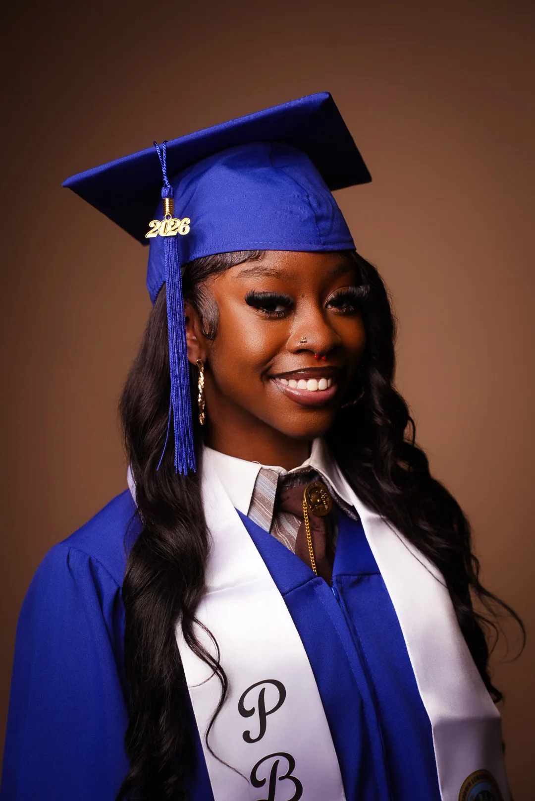 Graduate in a blue cap and gown