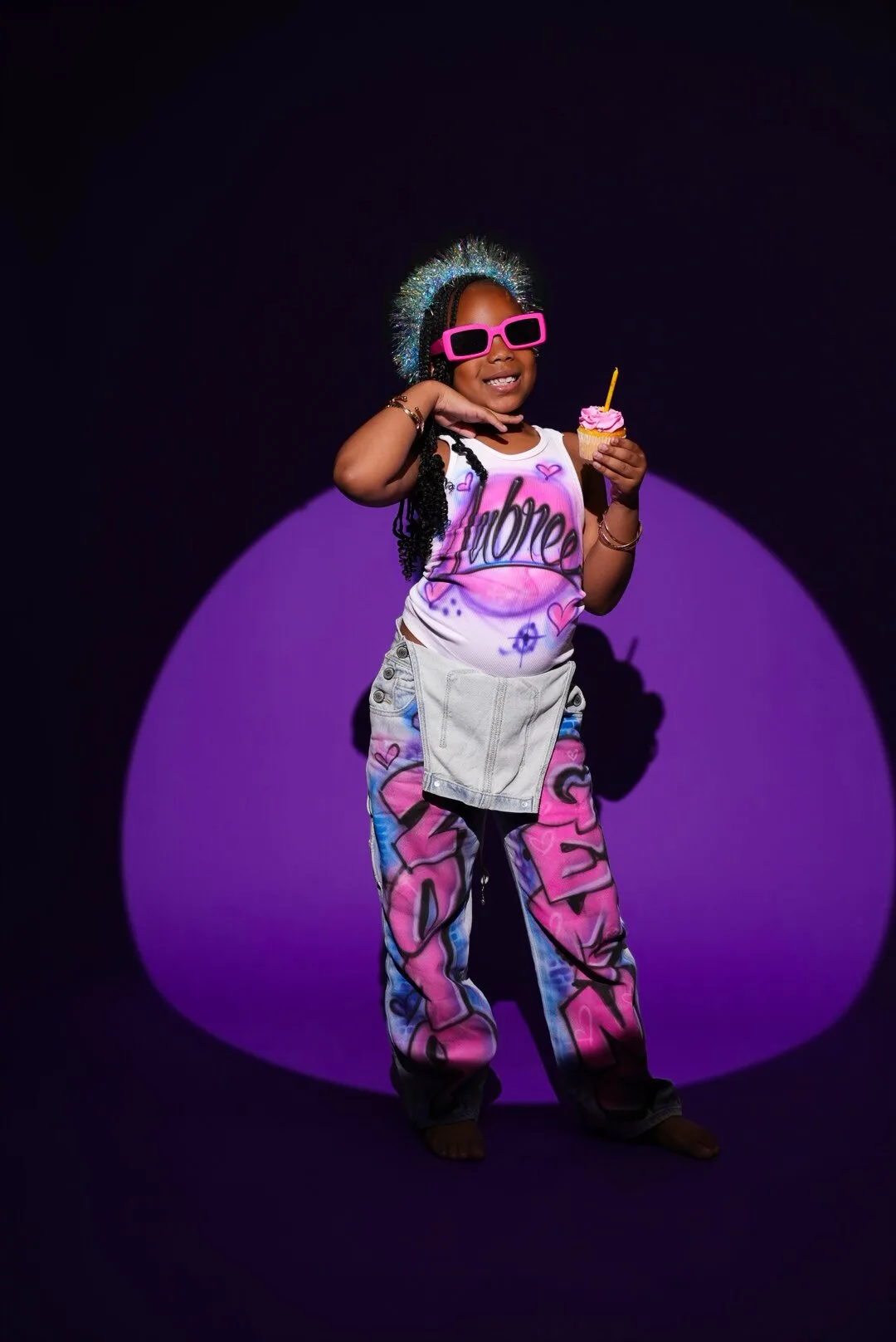 Colorful creative portrait under a purple spotlight
